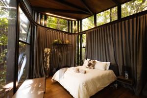 a bedroom with a bed with two teddy bears on it at Natures View in Pretoria