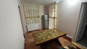 a small room with a table and a refrigerator at luiza in Batumi