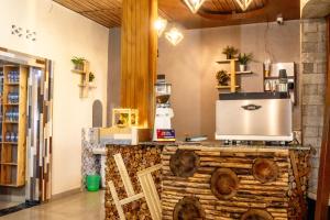 a kitchen with a counter with a appliance on it at La Roca in Kiryi