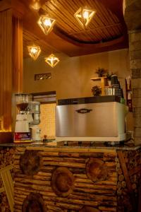 a kitchen with a counter with a appliance on it at La Roca in Kiryi