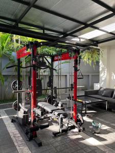 a gym with several tread machines in a room at Live with lion in Chiang Mai