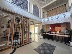 a large room with a large building with aasteryasteryasteryasteryasteryasteryastery at Hotel Khiva Palace in Khiva