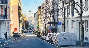 a city street with cars parked on the side of the road at Piso Chauderon in Lausanne