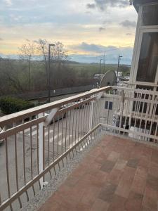 a balcony with a white railing on a house at Pella House in Airasca