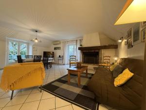 a living room with a couch and a fireplace at Millerou in Montory +23 photos