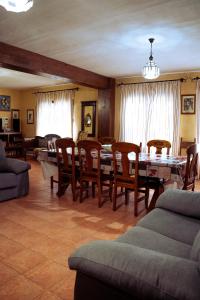 a living room with a table and chairs at Finca Vitoria in Moratalla