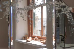 a window with a figurine of a dress on it at 3 Bed in Belper oc-dcbobb in Belper
