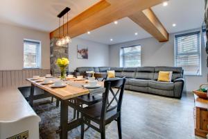 a kitchen and living room with a table and a couch at 5 Bed in Bala oc-bow163 in Bala