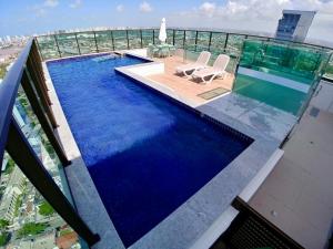 a swimming pool on the roof of a building at Flat Ilha do Leite in Recife +11 photos