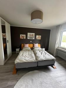 a bedroom with a large bed in a room at Mia's Landzeit in Nettersheim