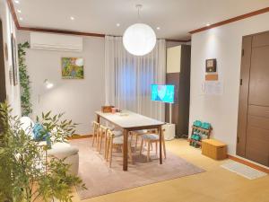 a dining room with a table and chairs at 대구 K Stay in Daegu