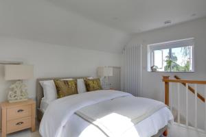 a bedroom with a white bed and a window at 1 Bed in Cranbrook oc-cb652 in Cranbrook