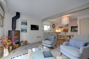 a living room with a fireplace and a dining room at 1 Bed in Cranbrook oc-cb652 in Cranbrook