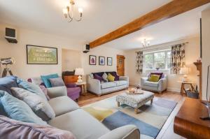 a living room with a couch and a table at 3 Bed in Bodham oc-1638 in Bodham