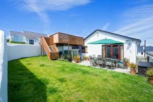 a house with a patio and a lawn at 3 Bed in Abersoch oc-kook72 in Abersoch