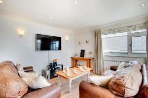 a living room with two couches and a table at 3 Bed in Abersoch oc-kook72 in Abersoch