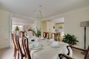 a dining room with a table and chairs at 3 Bed in Cley oc-2122 in Cley next the Sea +12 photos