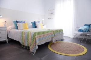 Postel nebo postele na pokoji v ubytování Hostal La Casa Sanlúcar