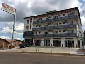 a hotel agency building with a truck parked in front at Hotel Zagonel in Chapecó