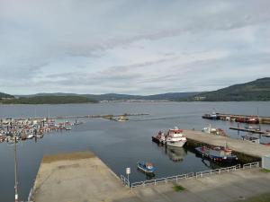 a bunch of boats are docked in a harbor at Piso Adrian in Sierra de Outes
