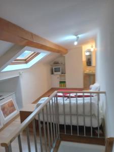 a living room with a skylight and a bed at Piso Adrian in Sierra de Outes