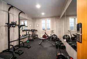 a gym with a bunch of exercise bikes in it at Hotel Jokipuisto in Kotka