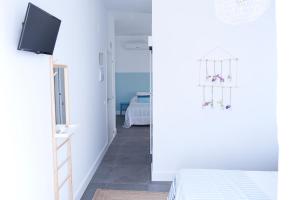 Postel nebo postele na pokoji v ubytování Hostal La Casa Sanlúcar