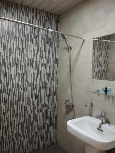 a bathroom with a sink and a shower at The Corner Hotel in Yerevan +38 photos