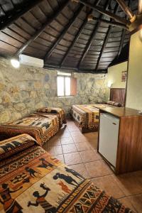 a room with four beds and a counter in it at Hotel Selwo Lodge - Animal Park Tickets Included in Estepona +36 photos