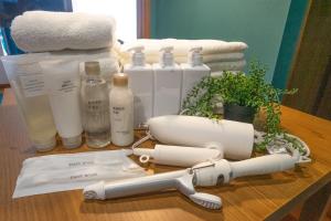 a table topped with lots of bottles and towels at cozy 3rd stay in Okayama
