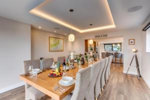 a dining room with a long wooden table and chairs at 5 Bed in Walmer oc-do022 in Kingsdown