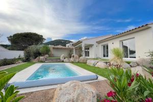 a swimming pool in the yard of a house at CASA VIGNA - villa T4 piscine privée in Sainte-Lucie de Porto-Vecchio