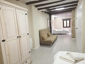 a room with a bed and a chair and a bedroom at CAL MA Ponts in Ponst +36 photos
