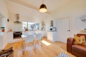 a kitchen and living room with a table and chairs at 1 Bed in Trimley St. Martin nr Felixstowe oc-obat in Trimley Heath +14 photos