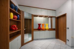 a walk in closet with vases on the shelves at Appartamento Corso Italia 269 in Sorrento