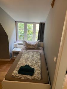 a small room with a bed in the corner at Flensburg Zentrum 69 03 in Flensburg