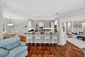 a kitchen and living room with a couch and a table at GE317: 317 Glen Eagle in Kiawah Island