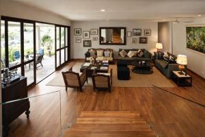 a living room with a couch and a table at Hailsham Bungalow in Sri Jayewardenepura Kotte