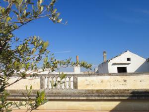 a white building on top of a bridge at Palazzo Luceri in Galatina
