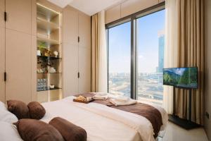 a bedroom with a bed with a large window at NOVA HOME Apartments - NEST ONE, Panoramic Views, Tashkent City in Tashkent