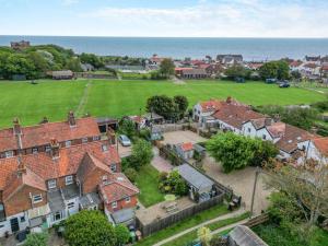 an aerial view of a house with a field at 2 Bed in Mundesley oc-1353 in Mundesley
