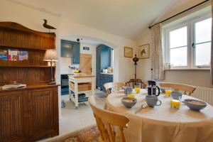 a kitchen and dining room with a table and chairs at 2 Bed in Aldborough oc-2174 in Thurgarton