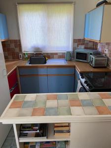 a kitchen with a sink and a counter top at Bolthole in Hayle