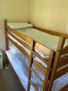 a pair of bunk beds in a room at Bolthole in Hayle +1 photo