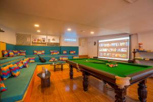 a billiard room with a pool table in it at goSTOPS Ooty in Ooty