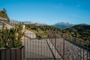 a balcony with a view of the mountains at Hotel am Hang in Soprabolzano