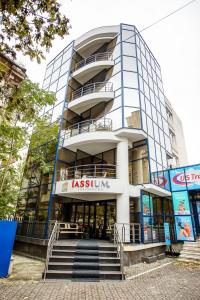 a tall building with stairs in front of it at Iassium Residence Iasi in Iaşi