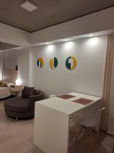 a living room with a couch and a table at Toscana Apart in San Miguel de Tucumán