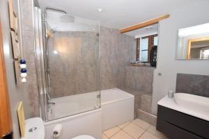 a bathroom with a shower and a toilet and a sink at 2 Bed in Braunton oc-stabb in Braunton +19 photos