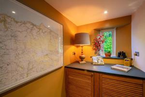 a room with a large map on the wall at 2 Bed in Lynton oc-trelyn in Lynmouth +12 photos